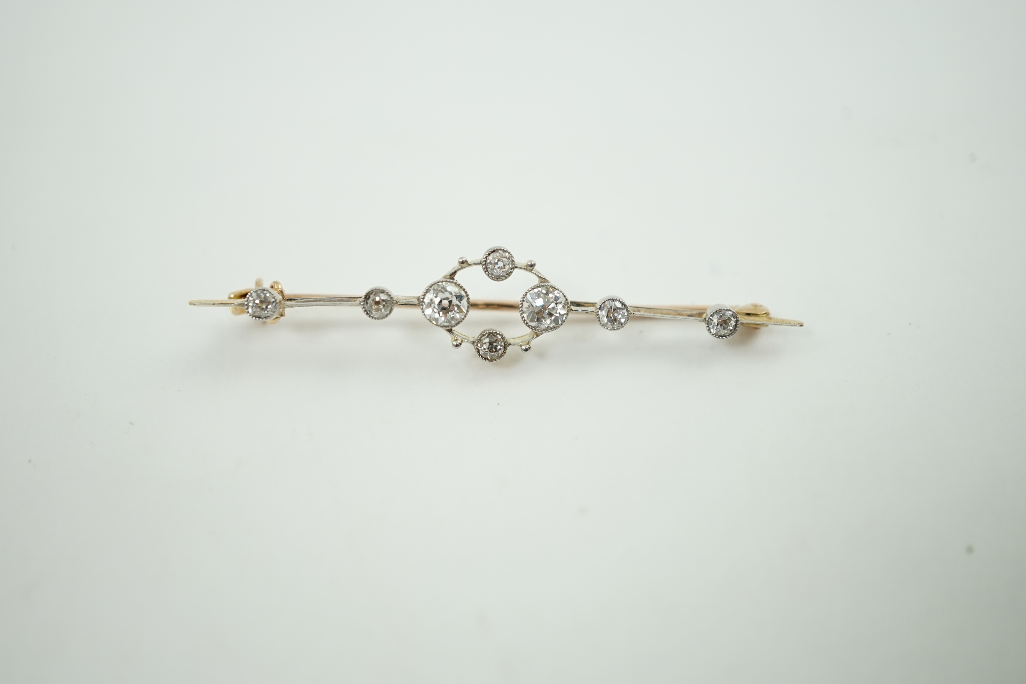 A Belle Epoque gold an diamond cluster set open work bar brooch
